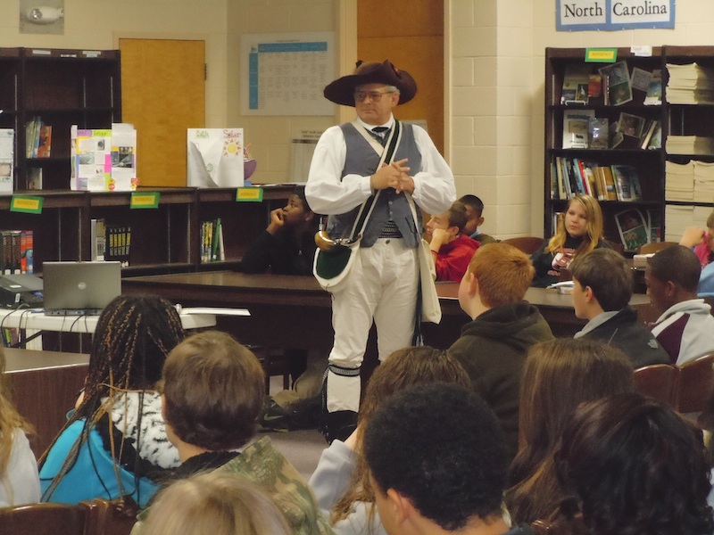SAR Halifax Resolves chapter president Ken Wilson delivers a presentation to school students about the Revolutionary War.