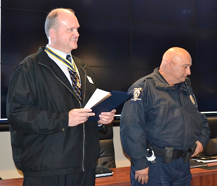 Mecklenburg SAR chapter president Jay Joyce presents the SAR Law Enforcement Commendation Medal to CMPD Detective Danny  Hernandez on December 7, 2015.