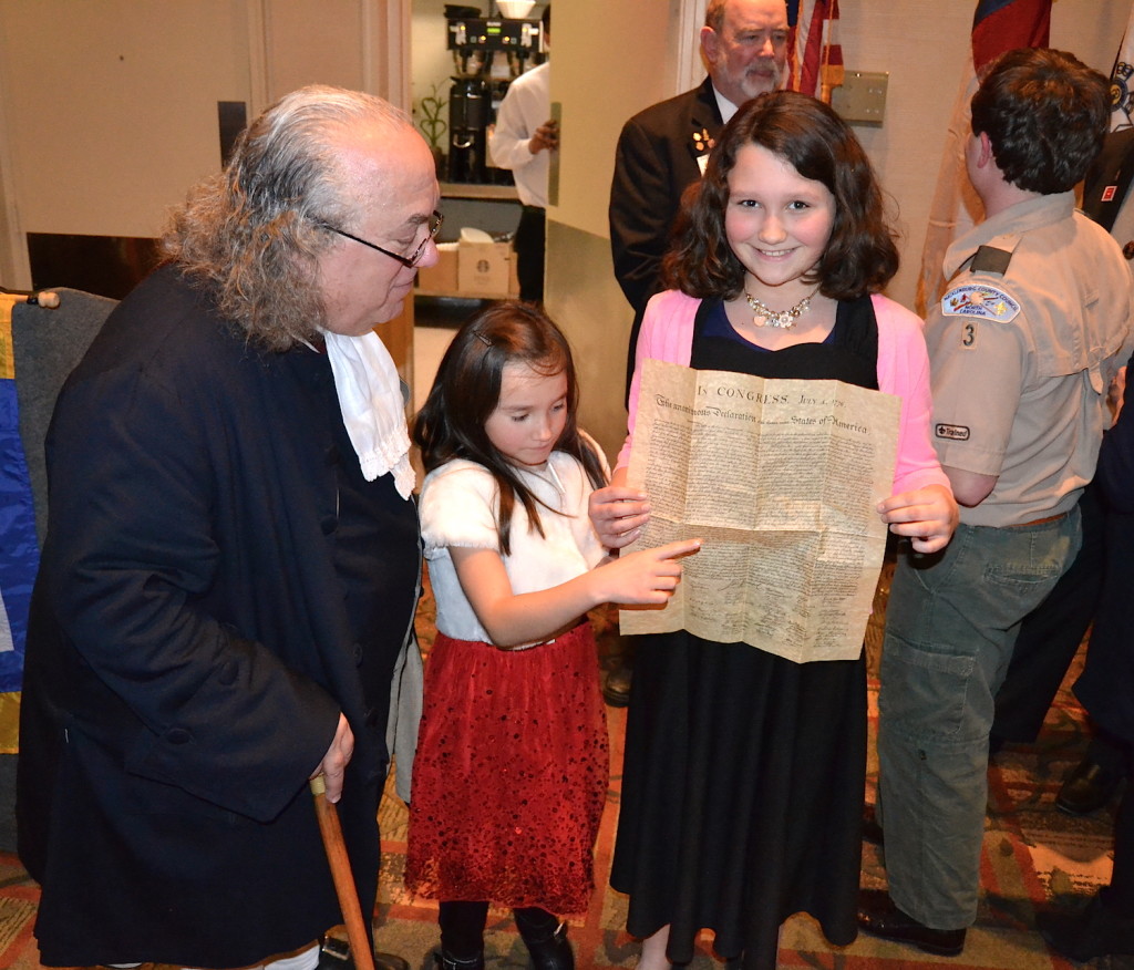 SAR member Adam Zollinger's children meet Benjamin Franklin on February 18 2016 at the Mecklenburg Chapter's President's Day Community Dinner on February 18 2016.