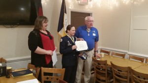 Cadet Samantha Jones receives Lower Cape Fear Chapter Enhance JROTC cadet Award from Compatriot Gary O. Green as mother looks on