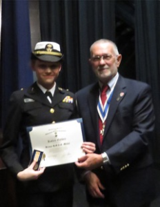 Rolf Maris, New Bern Chapter President, and awardee, New Bern High School cadet, Katlyn Golden.