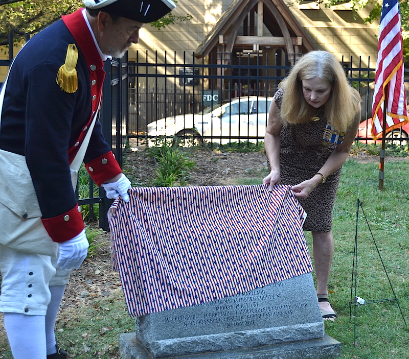 Mecklenburg chapter president Ken Luckey unveils the monument for Patriot Ephraim Brevard on September 24 2016 in Charlotte.